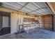 A functional garage with shelving, work bench, and organized storage for tools and accessories at 15845 N 60Th Dr, Glendale, AZ 85306