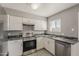 Bright kitchen with stainless steel oven, updated appliances, and neutral color palette at 15845 N 60Th Dr, Glendale, AZ 85306