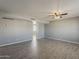 Open-concept living room featuring updated floors, neutral walls, and modern lighting at 15845 N 60Th Dr, Glendale, AZ 85306