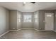 Inviting living room with bay window, new floors, and neutral colors at 15845 N 60Th Dr, Glendale, AZ 85306