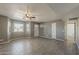 Spacious living room with new floors, neutral colors, and ample natural light at 15845 N 60Th Dr, Glendale, AZ 85306