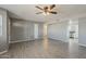 Cozy living room with tile floors, ceiling fan, and easy access to the kitchen at 15845 N 60Th Dr, Glendale, AZ 85306