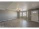 Bright living room showcasing updated flooring, neutral walls, and lots of natural light at 15845 N 60Th Dr, Glendale, AZ 85306