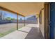A covered patio overlooks a landscaped backyard with privacy fencing at 15845 N 60Th Dr, Glendale, AZ 85306