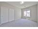Serene bedroom with soft carpet, natural light, and a closet with sliding doors at 16874 W Tonbridge St, Surprise, AZ 85374