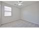 Bedroom featuring neutral carpet, a ceiling fan, and window with blinds at 16874 W Tonbridge St, Surprise, AZ 85374