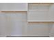 Walk-in closet with shelving and hanging rods at 16874 W Tonbridge St, Surprise, AZ 85374