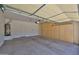 Spacious two-car garage with ample storage cabinets and water heater at 16874 W Tonbridge St, Surprise, AZ 85374