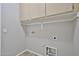 Laundry room featuring utility connections and built-in cabinets at 16874 W Tonbridge St, Surprise, AZ 85374