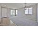 Open living room featuring carpet, recessed lighting, and natural light from the windows at 16874 W Tonbridge St, Surprise, AZ 85374