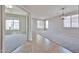 A spacious living room with plush carpet, bright windows, and modern lighting at 16874 W Tonbridge St, Surprise, AZ 85374