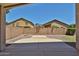 Private outdoor space with covered patio, block wall, and beautiful desert landscaping at 16874 W Tonbridge St, Surprise, AZ 85374