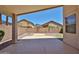 Covered patio with desert landscaping offering a private outdoor space at 16874 W Tonbridge St, Surprise, AZ 85374