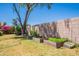 Spacious backyard featuring raised garden beds, offering potential for gardening and outdoor enjoyment at 170 E Canary Ct, San Tan Valley, AZ 85143