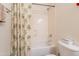 Bright bathroom featuring a tub and shower combo with a decorative tropical-themed shower curtain at 170 E Canary Ct, San Tan Valley, AZ 85143
