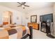Bright bedroom featuring a ceiling fan, dresser, and a TV, creating a relaxing atmosphere at 170 E Canary Ct, San Tan Valley, AZ 85143