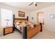 Cozy bedroom with a large bed, bedside table, and window offering natural light at 170 E Canary Ct, San Tan Valley, AZ 85143