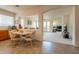 Dining room leading to living room with lots of natural light and modern finishes at 170 E Canary Ct, San Tan Valley, AZ 85143