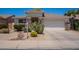 Charming single-story home with desert landscaping, rock accents, and a two-car garage at 170 E Canary Ct, San Tan Valley, AZ 85143