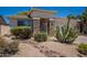 Well-maintained single-story home with desert landscape, stone accents, and a convenient two-car garage at 170 E Canary Ct, San Tan Valley, AZ 85143