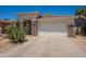 Well-maintained single-story home with desert landscaping, stone accents, and an attached two-car garage at 170 E Canary Ct, San Tan Valley, AZ 85143