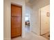 Bright hallway features storage cabinets and leads to rooms with neutral walls and carpeted floors at 170 E Canary Ct, San Tan Valley, AZ 85143