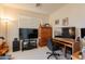 Comfortable home office with multiple monitors, a desk, and a black office chair at 170 E Canary Ct, San Tan Valley, AZ 85143