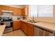 Clean kitchen featuring stainless appliances, ample counter space, and natural light at 170 E Canary Ct, San Tan Valley, AZ 85143
