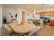 Spacious dining area adjacent to a kitchen with stainless steel appliances and breakfast bar at 170 E Canary Ct, San Tan Valley, AZ 85143
