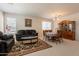Spacious living room with a cozy sofa, elegant dining set, and a decorative area rug at 170 E Canary Ct, San Tan Valley, AZ 85143
