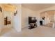 Bright living room featuring neutral walls, open layout, and a modern entertainment center at 170 E Canary Ct, San Tan Valley, AZ 85143