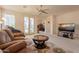Cozy living room featuring carpet, a ceiling fan, and access to the patio at 170 E Canary Ct, San Tan Valley, AZ 85143