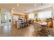 Open concept kitchen and dining area with breakfast bar seating and natural light at 170 E Canary Ct, San Tan Valley, AZ 85143
