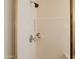 Shower featuring chrome fixtures and convenient shelving for toiletries at 170 E Canary Ct, San Tan Valley, AZ 85143