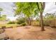 The backyard features a firepit, grass, trees, and a block wall at 1708 E Westchester Dr, Tempe, AZ 85283