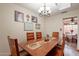 Bright dining room featuring a wooden table and an open view into the well-lit eat-in kitchen at 1708 E Westchester Dr, Tempe, AZ 85283