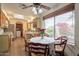 Cozy eat-in kitchen featuring wooden cabinets, stainless appliances, and a window view of the well-maintained backyard at 1708 E Westchester Dr, Tempe, AZ 85283