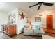 Comfortable living room featuring a sofa, hardwood flooring, and a ceiling fan at 1708 E Westchester Dr, Tempe, AZ 85283