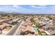 Neighborhood aerial view featuring tile roofs, a street, and a pool in one of the backyards with mountain backdrop at 1744 E Fremont Rd, Phoenix, AZ 85042