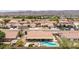 Panoramic aerial view of residential neighborhood with mountain backdrop and backyard pool at 1744 E Fremont Rd, Phoenix, AZ 85042