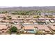 Beautiful community aerial view with mountain backdrop, backyard pools, and manicured landscaping at 1744 E Fremont Rd, Phoenix, AZ 85042