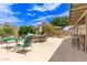 Inviting covered back patio features an outdoor kitchen and multiple seating arrangements at 1744 E Fremont Rd, Phoenix, AZ 85042