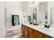 Bright bathroom featuring a double sink vanity with modern fixtures and white tile at 1744 E Fremont Rd, Phoenix, AZ 85042