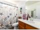 Cozy bathroom featuring beach themed shower curtain, fixtures and decor at 1744 E Fremont Rd, Phoenix, AZ 85042