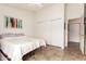 Comfortable bedroom with tile floors, closet and bed at 1744 E Fremont Rd, Phoenix, AZ 85042