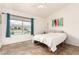 Cozy bedroom with tile flooring, a ceiling fan, and a window with neighborhood views at 1744 E Fremont Rd, Phoenix, AZ 85042