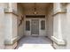 Inviting entryway with decorative door and neutral color scheme, creating a warm and welcoming ambiance at 1744 E Fremont Rd, Phoenix, AZ 85042