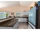 Kitchen with stone countertops, tiled floor, and ample lighting showcasing functionality at 1744 E Fremont Rd, Phoenix, AZ 85042