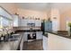 Well-lit kitchen with granite countertops and appliances offers efficient meal preparation at 1744 E Fremont Rd, Phoenix, AZ 85042
