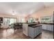 Open-concept kitchen and dining area flooded with light and a kitchen island for extra counter space at 1744 E Fremont Rd, Phoenix, AZ 85042